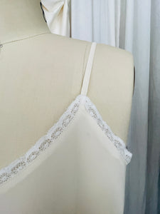 100% Crepe de Chine silk dress with cotton lace trim, spaghetti straps.