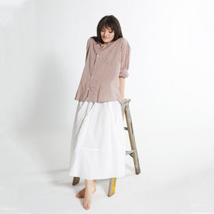 Model wearing Oversized cotton voile shirt with pearl shell buttons.